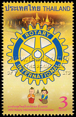 Logo of the International Rotary Club with the Thai mascots of the 2012 International Convention and the illuminated Grand Palace at night
