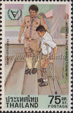 a crippled schoolboy with crutches ascending a flight of steps aided by a boy scout