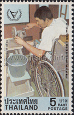 a disabled man in a wheelchair cutting gems on a whetstone